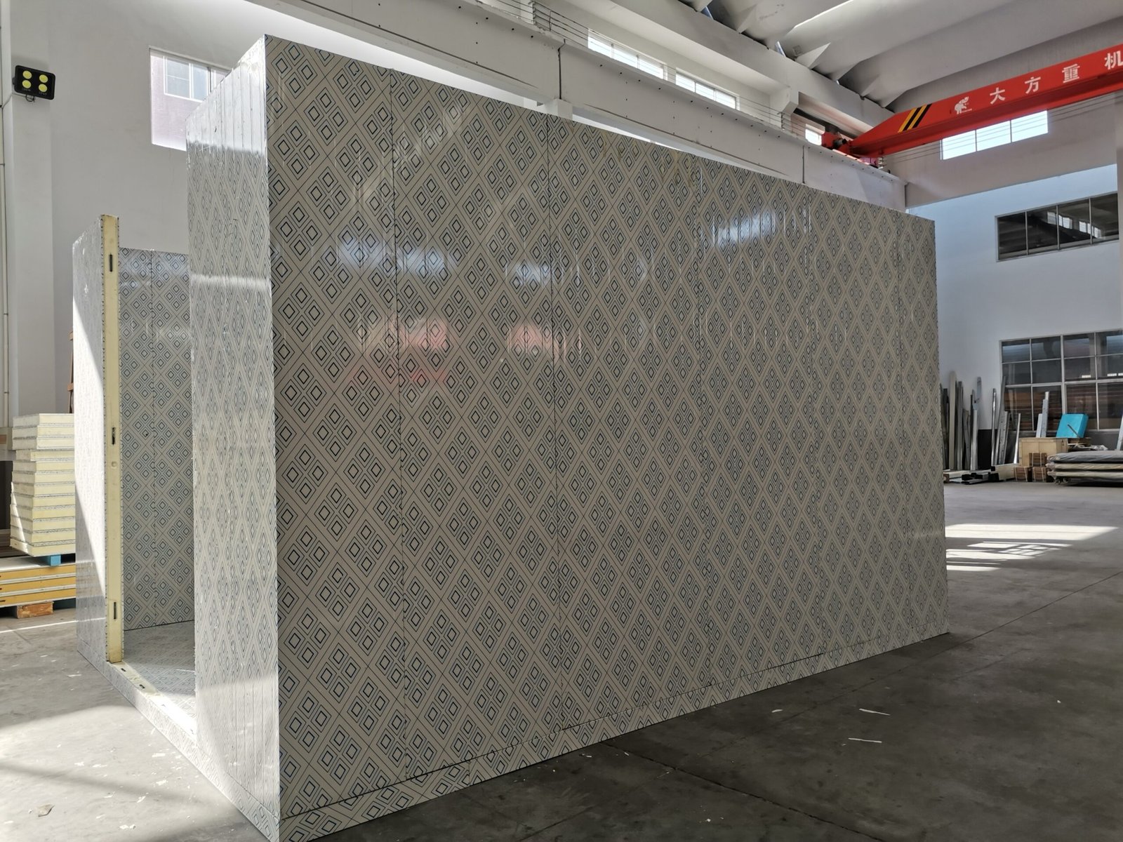 L-shaped insulated corner panel with protective surface film