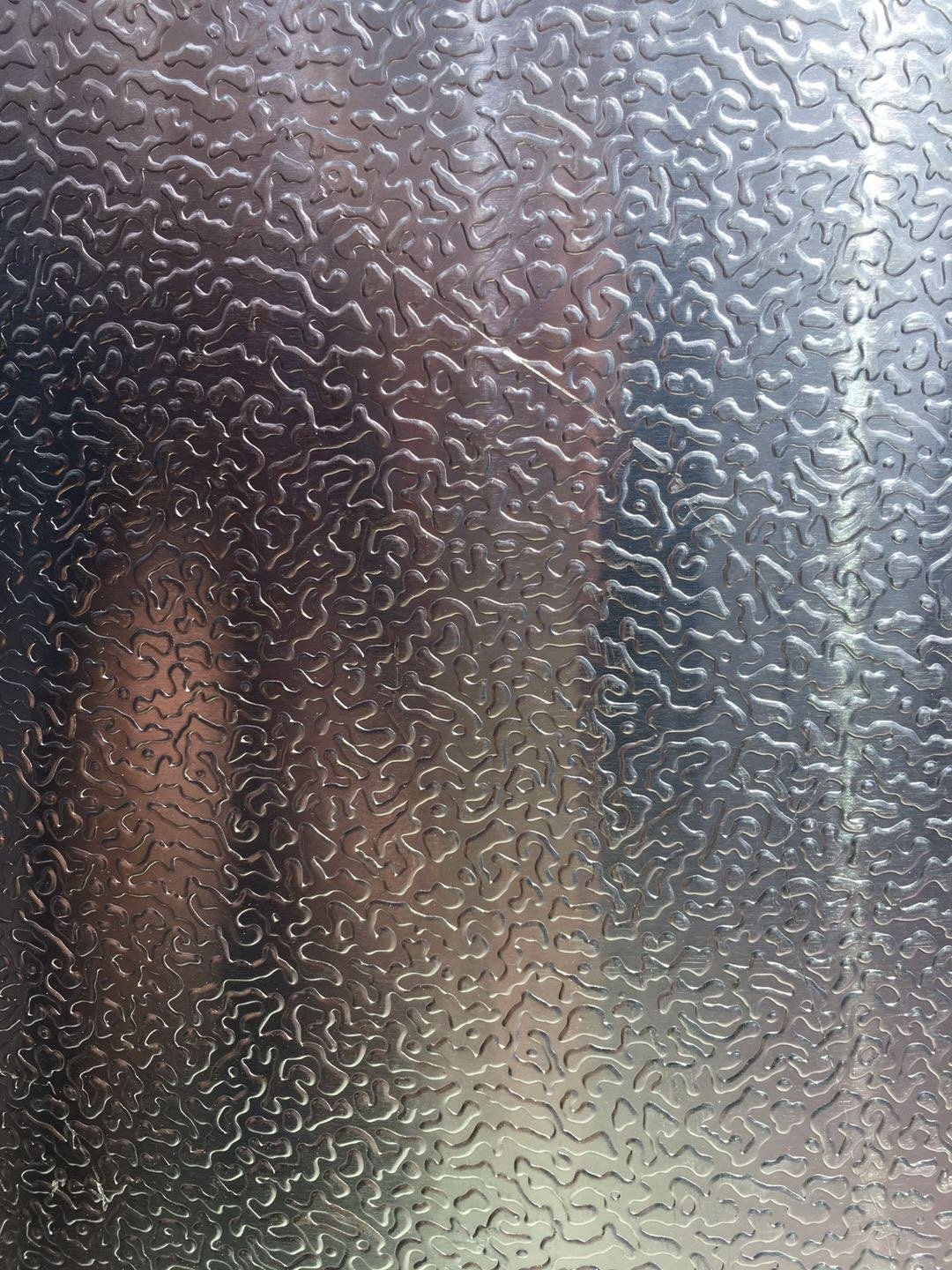 Close-up of embossed aluminum surface texture